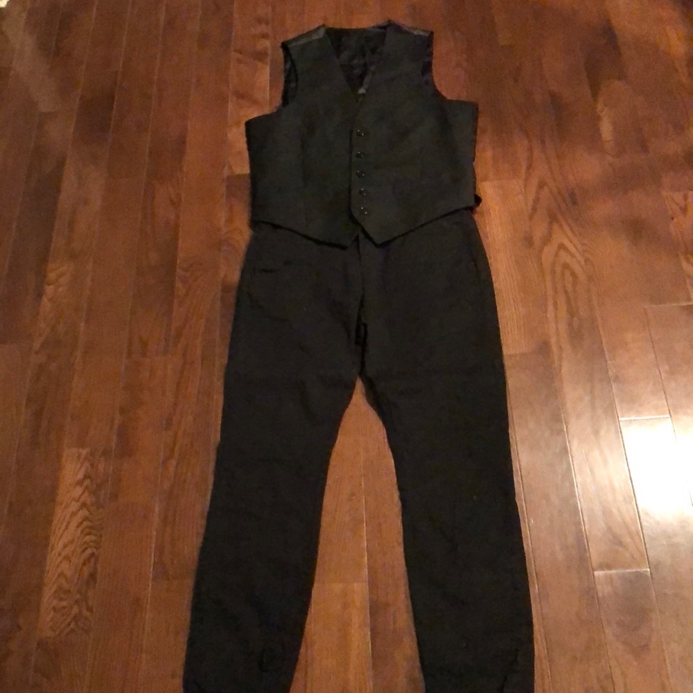 Black dress pants along with black vest